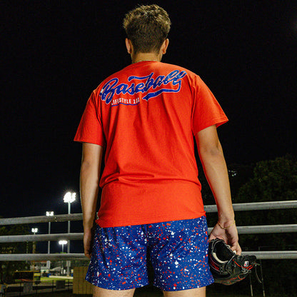 Adult model wearing red, white & blue Splatter USA shorts