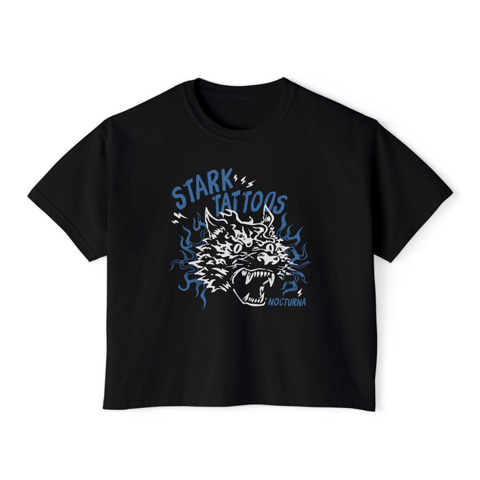 thtgrlreads Wolves of Ruin collection features a black Comfort Colors crop top with a vintage-style blue and white graphic of a roaring wolf head and "Stark Tattoos" text, offered by Printify in the Tees category.