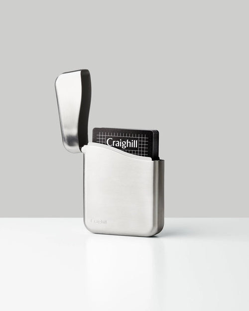Stainless steel playing card case, front pocket open with Craighill card holder visible
