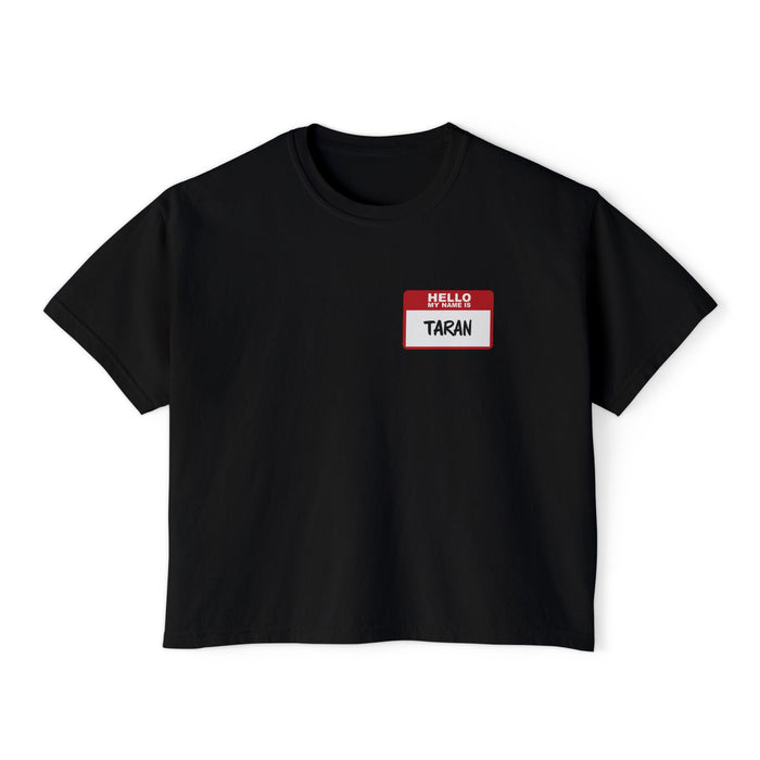A black vintage wash comfort colors cropped t-shirt from thtgrlreads featuring a red and white "Hello My Name Is Taran" nametag graphic, part of the Kindred's Curse Saga collection.