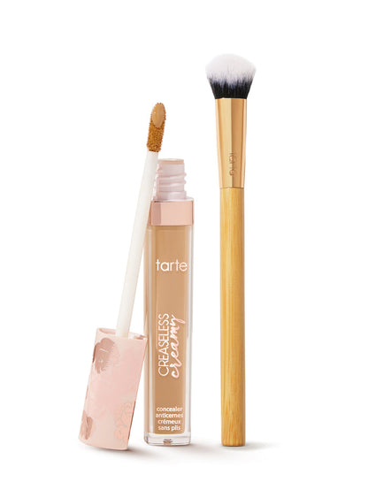 tarte creaseless creamy concealer concealer with applicator and brush on a white background