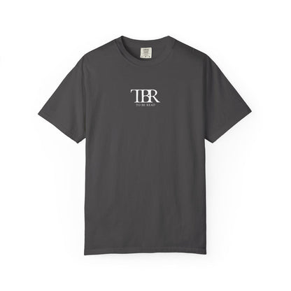 Thtgrlreads Comfort Colors graphic tee from The Life of a Book Bestie collection featuring a minimalist "TBR To Be Read" vintage wash design in white text on soft charcoal fabric.
