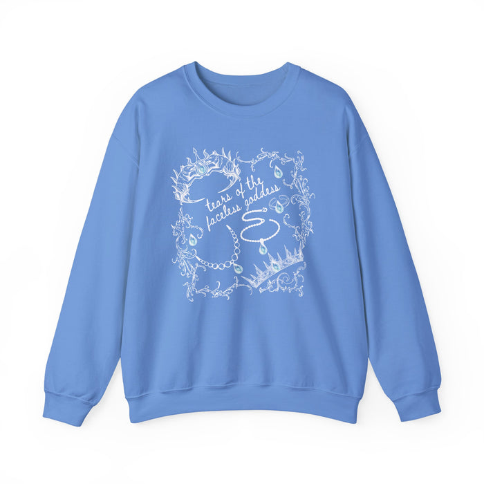 A cozy blue oversized crewneck sweatshirt from thtgrlreads featuring a vintage white intricate line art design with text "tears of the faceless goddess," part of the Wolves of Ruin collection, printed on a premium Comfort Colors base by Printify.