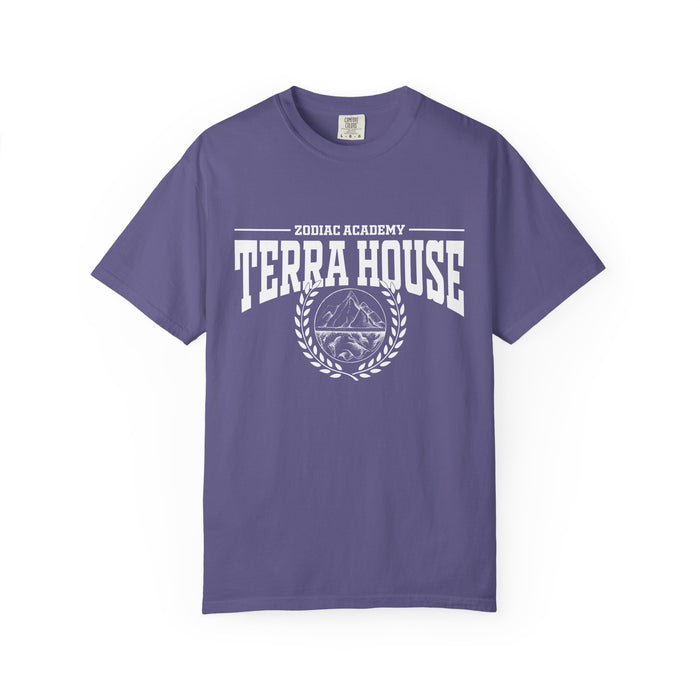 A purple Comfort Colors graphic tee from thtgrlreads featuring a vintage white print with "Zodiac Academy Terra House" text and a mountain emblem, part of Zodiac Academy and Back to School collections.