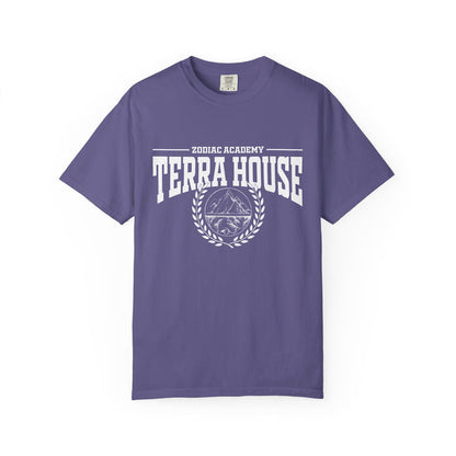 A purple Comfort Colors graphic tee from thtgrlreads featuring a vintage white print with "Zodiac Academy Terra House" text and a mountain emblem, part of Zodiac Academy and Back to School collections.