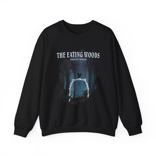 An officially licensed black oversized crewneck sweatshirt from thtgrlreads featuring The Eating Woods collection, with a vintage-style forest graphic and text print on Comfort Colors fabric.