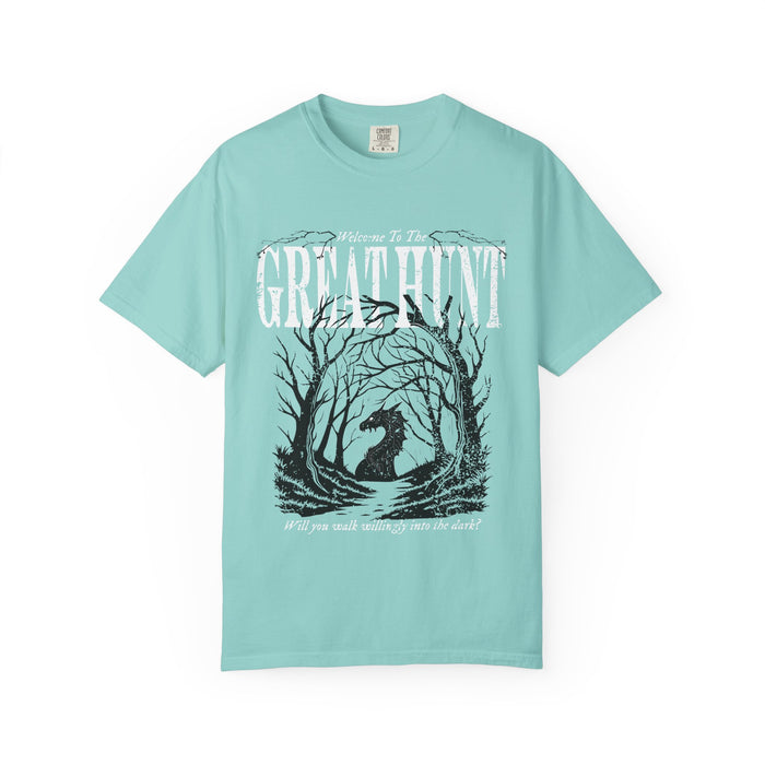 A vintage wash Comfort Colors graphic tee from thtgrlreads featuring a dark fantasy design of a silhouetted figure within twisted trees and text reading "Welcome to The Great Hunt," part of the Tees and Hollow collections.