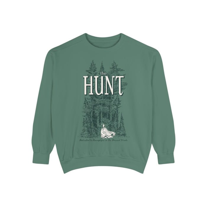 Thtgrlreads oversized crewneck from The Poison Daughter collection featuring vintage-wash green Comfort Colors fabric with a detailed graphic of a forest and a flowing-dress figure beneath "The Hunt" text in serif font.