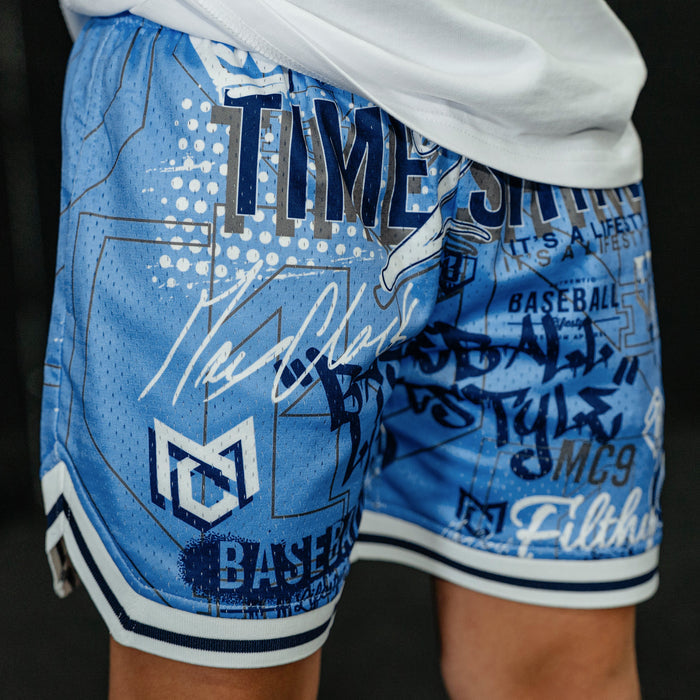 Youth model wearing blue Time 2 Shine Icons Court youth shorts