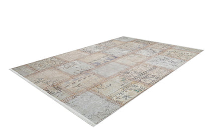 The Urban Utopia - Washable Rug - JR1957 is a rectangular, patchwork-style flat weave rug in muted beige, cream, and light brown tones with subtle patterns and floral designs, showcased on a white background.