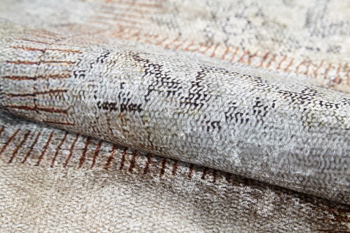 A close-up of the Urban Utopia - Washable Rug - JR1957 reveals a textured flat weave in light beige and gray, with thin, irregular lines—perfect for those seeking stylish cream and beige rugs.