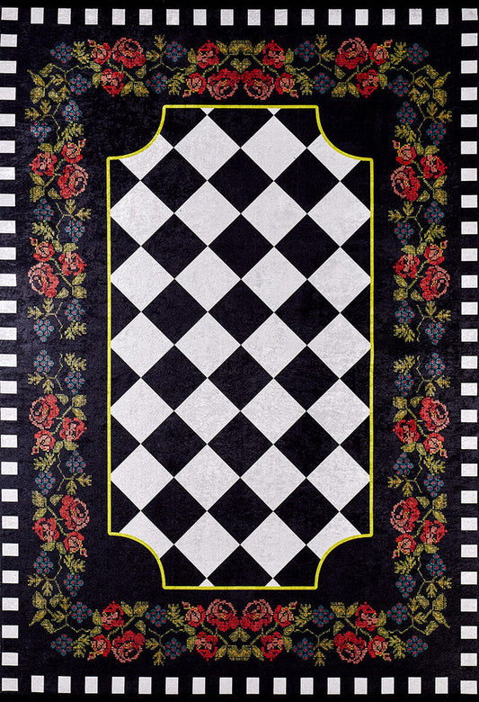 The Wildflower Wonderland - Washable Rug - JR587 is a flat weave black rug with a black and white diamond checkerboard center, yellow borders, and a vibrant floral pattern of red, blue, and green flowers on a washable black background.