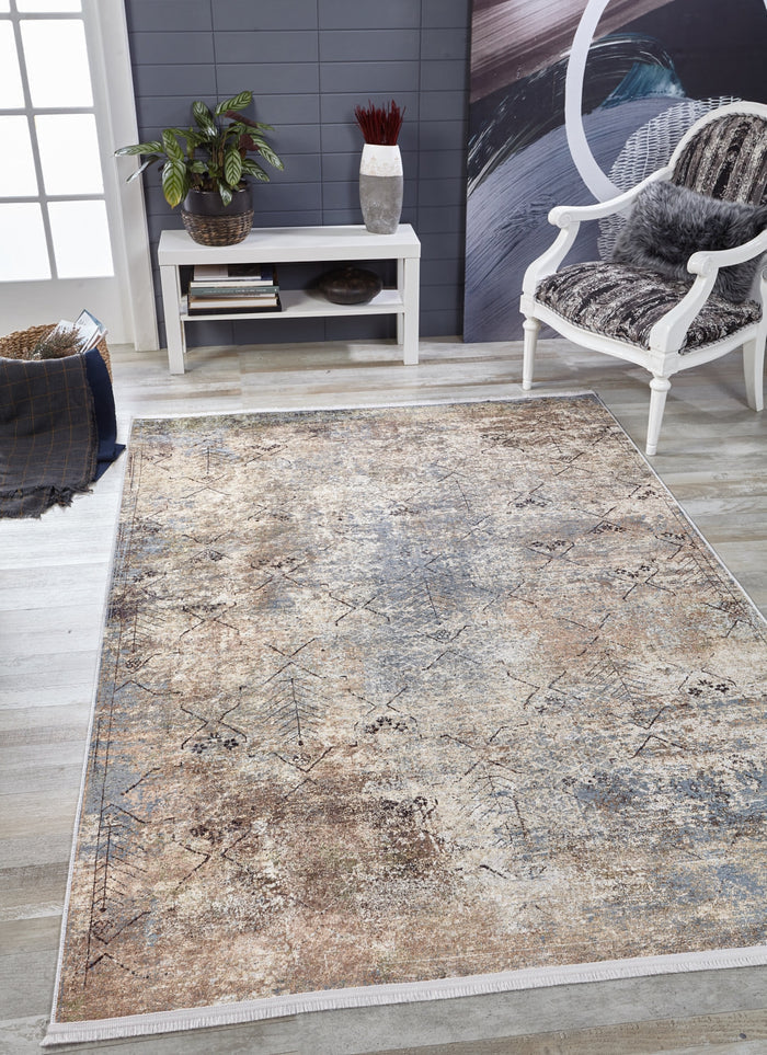 The Windowpane Trellis - Washable Rug - JR1663, featuring a neutral distressed design, rests on light wood floors—ideal for high-traffic areas. Nearby: a white chair with fur cushion, console table with decor, plant, and a basket with blanket.