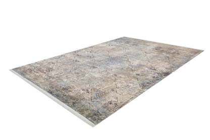 The Windowpane Trellis Washable Rug (JR1663) is a large, rectangular rug with a faded beige, blue, and brown distressed pattern. Its subtle geometric and floral designs with fringed short edges make it ideal for high-traffic areas.